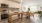 kitchen and dining area with two tables and chairs